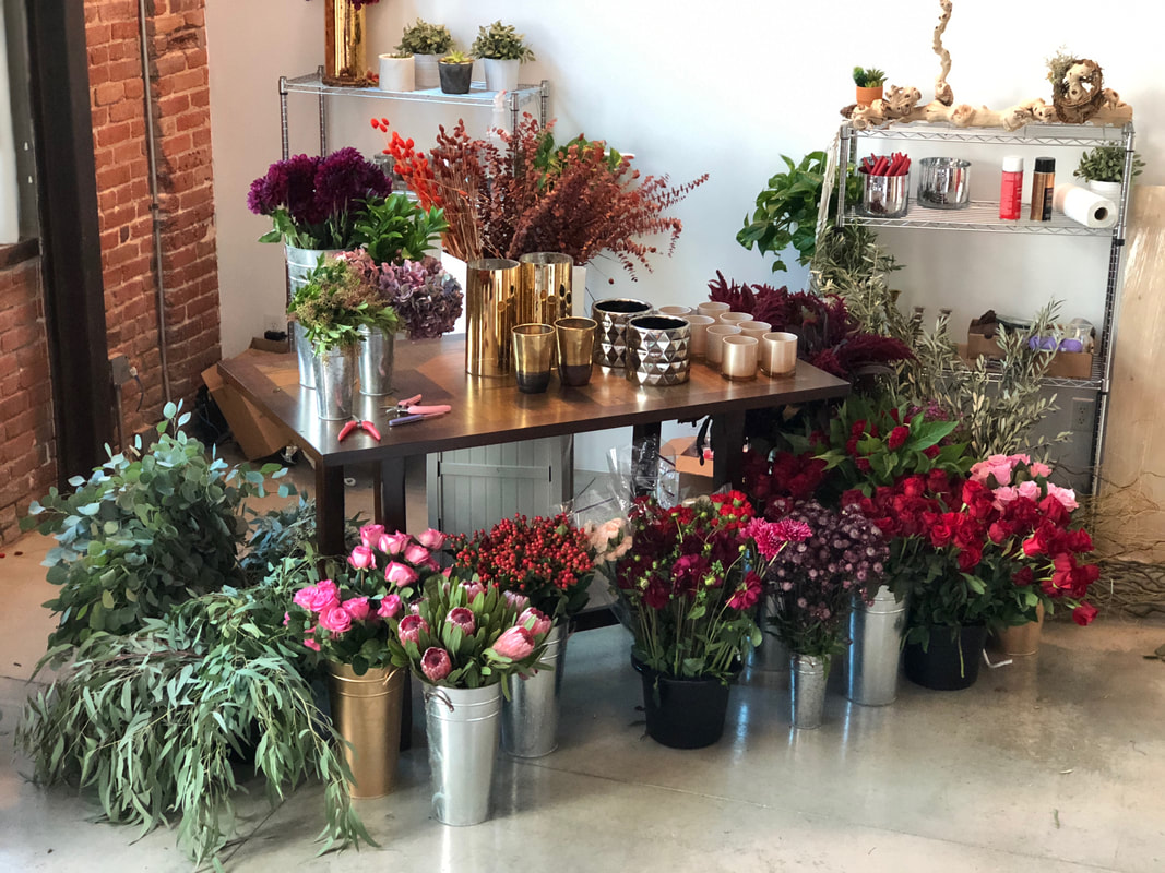 A table adorned with various flowers and plants